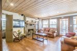 Living room view of decorative fireplace & TV